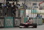 ferrari-formula-one-driver-alonso-takes-checkered-flag-win-malaysian-f1-grand-prix-sepang.jpg