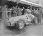 1950 Italian racing driver Alberto Ascari (1918 - 1955) at the wheel of his car at Silverstone.jpg