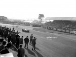 Macklin in a HWM wins as he passes the chequered flag at international trophy, 1953..jpg