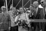 British racing driver Jim Clark celebrating his win after a Grand Prix, 1964.jpg